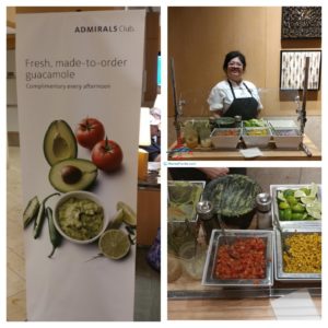 a woman standing behind a counter with food