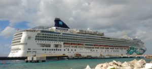 a large cruise ship docked at a dock