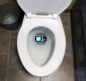 a cell phone in a toilet