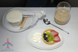 a plate of fruit tart and a spoon