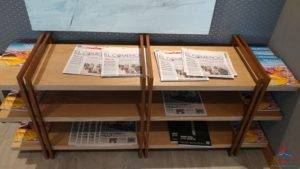 a shelf with newspapers on it