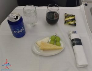 a plate of food and drinks on a table