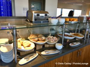 Bagels, pastries, and crepes are seen on the breakfast buffet inside The CLUB at SJC airport lounge at Norman Y. Mineta San Jose International Airport in San Jose, California.