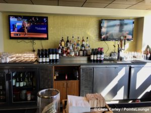 Liquor selections such as Jack Daniel’s, Jim Beam, Johnnie Walker Red, Tito’s vodka, Smirnoff vodka, Kahlua, Bailey’s Irish Cream, Disaronno amaretto, plus red and white wine are displayed atop the bar at The CLUB at SJC airport lounge at Norman Y. Mineta San Jose International Airport in San Jose, California.