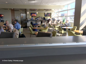 A power bar-power strip is placed atop a table near the bar and dining area at The CLUB at SJC airport lounge at Norman Y. Mineta San Jose International Airport in San Jose, California.