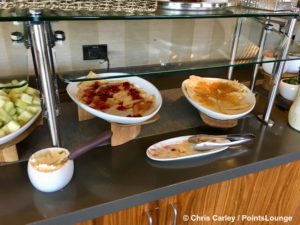 Breakfast crepes and fruit are displayed outside The CLUB at SJC airport lounge at Norman Y. Mineta San Jose International Airport in San Jose, California.