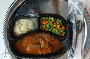 a plate of food on a tray