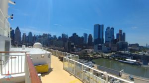 a city skyline with a boat deck