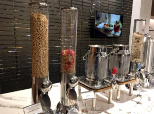 Honey Nut Cheerios and Special K cereals are seen alongside oatmeal at the breakfast buffet inside the Delta Sky Club Austin airport lounge at Austin-Bergstrom International Airport (AUS) in Austin, Texas. Photo © Chris Carley / PointsLounge