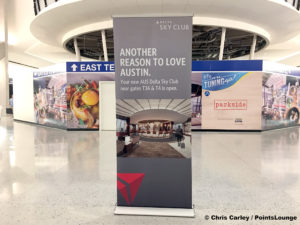 A sign reading "Another Reason to Love Austin" is seen outside the Delta Sky Club Austin airport lounge at Austin-Bergstrom International Airport (AUS) in Austin, Texas. Photo © Chris Carley / PointsLounge