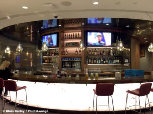 The bar and liquor bottles are seen at the Delta Sky Club Austin airport lounge at Austin-Bergstrom International Airport (AUS) in Austin, Texas. Photo © Chris Carley / PointsLounge