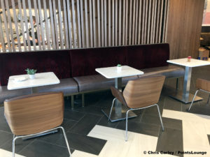 Dining room tables and chairs are seen at the Delta Sky Club Austin airport lounge in Austin, Texas. Photo © Chris Carley / PointsLounge