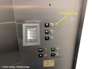 An elevator button illuminated for the Mezzanine or "M" level is illuminated outside the Delta Sky Club Austin airport lounge at Austin-Bergstrom International Airport (AUS) in Austin, Texas. Photo © Chris Carley / PointsLounge