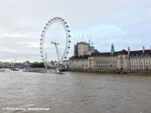 The London Eye and County Hall on the banks of the River Thames.