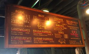 a menu board with writing on it