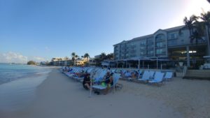 a group of people sitting on a beach