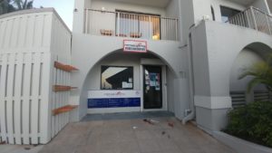 a building with a door and a balcony