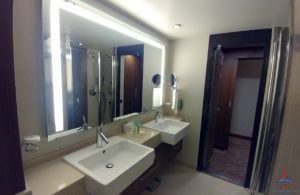 a bathroom with sinks and mirrors