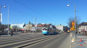 a blue train on the road