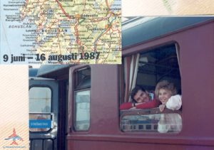 a group of people looking out of a train window