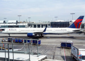 A Delta 757-300 plane (tail number N595NW) waits for a gate at Los Angeles International Airport (LAX).