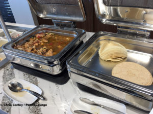 Braised chicken tacos and tortillas are seen at the Delta Sky Club Austin airport lounge at Austin-Bergstrom International Airport (AUS) in Austin, Texas. Photo © Chris Carley / PointsLounge