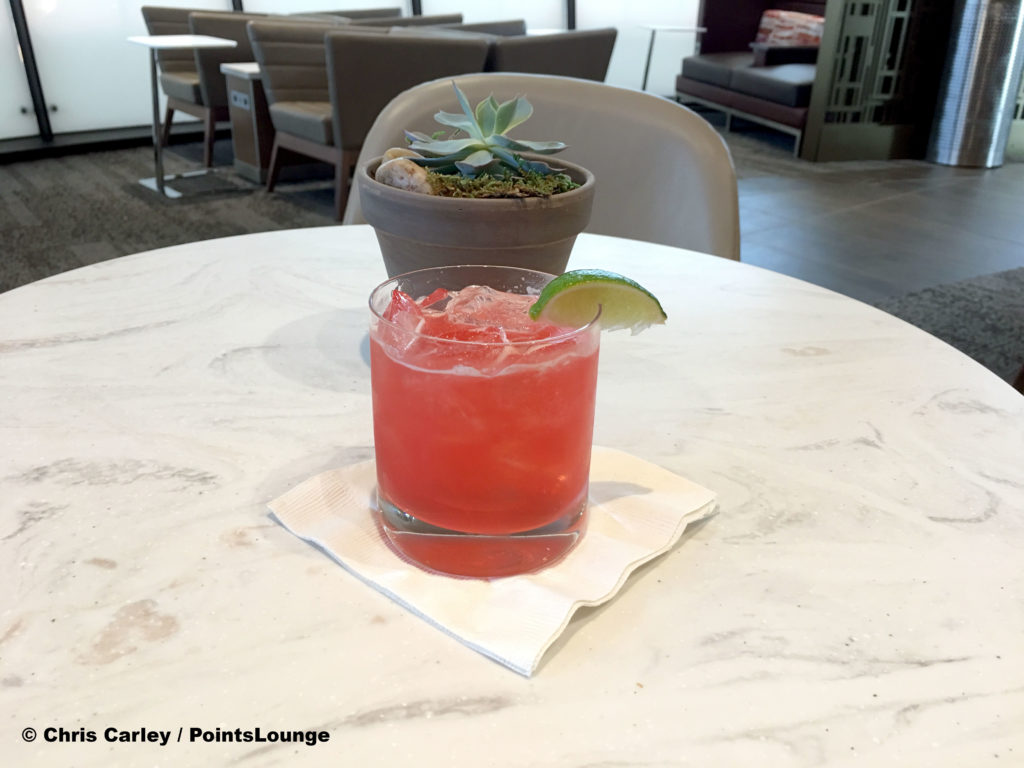 The Flower District Margarita signature cocktail drink is displayed at the Delta Sky Club Austin airport lounge at Austin-Bergstrom International Airport (AUS) in Austin, Texas. Photo © Chris Carley / PointsLounge