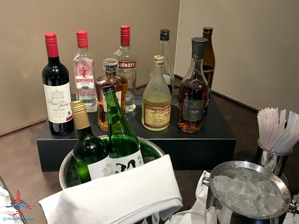 Wine, Sake, and liquor are offered inside the TIAT Lounge Annex location for Delta One passengers at Tokyo Haneda International Airport in Tokyo, Japan.