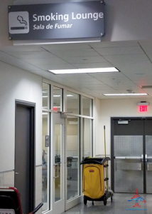 a yellow luggage cart in a hallway