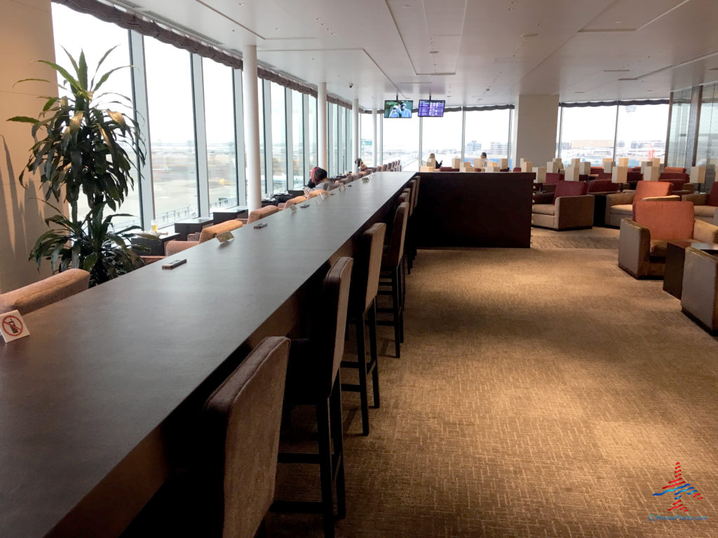 Chairs and tables inside the TIAT Lounge Annex location for Delta One passengers at Tokyo Haneda International Airport in Tokyo, Japan.