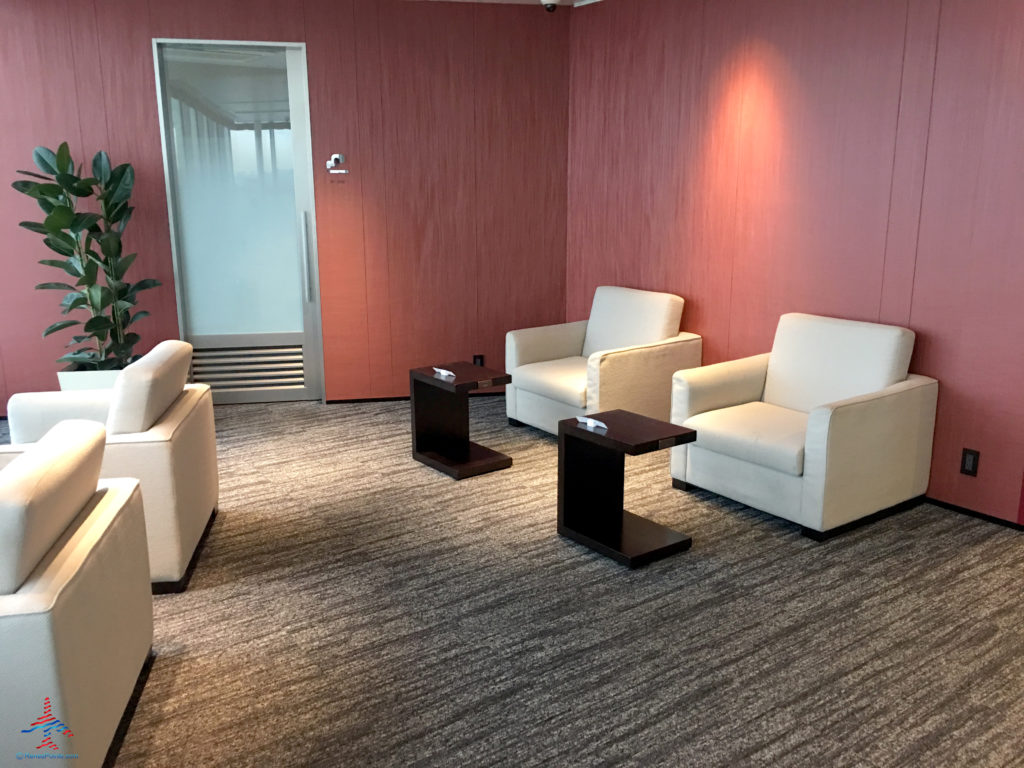 Chairs and tables inside the TIAT Lounge Annex location for Delta One passengers at Tokyo Haneda International Airport in Tokyo, Japan.