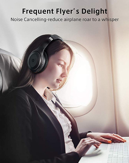 An airline passenger wears Utaxo Bluetooth Noise Cancelling Earphones