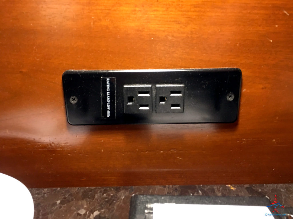 Power outlets are seen next to the bed of an executive king bedroom at the Hyatt Regency O'Hare Chicago airport hotel in Rosemont, Illinois.