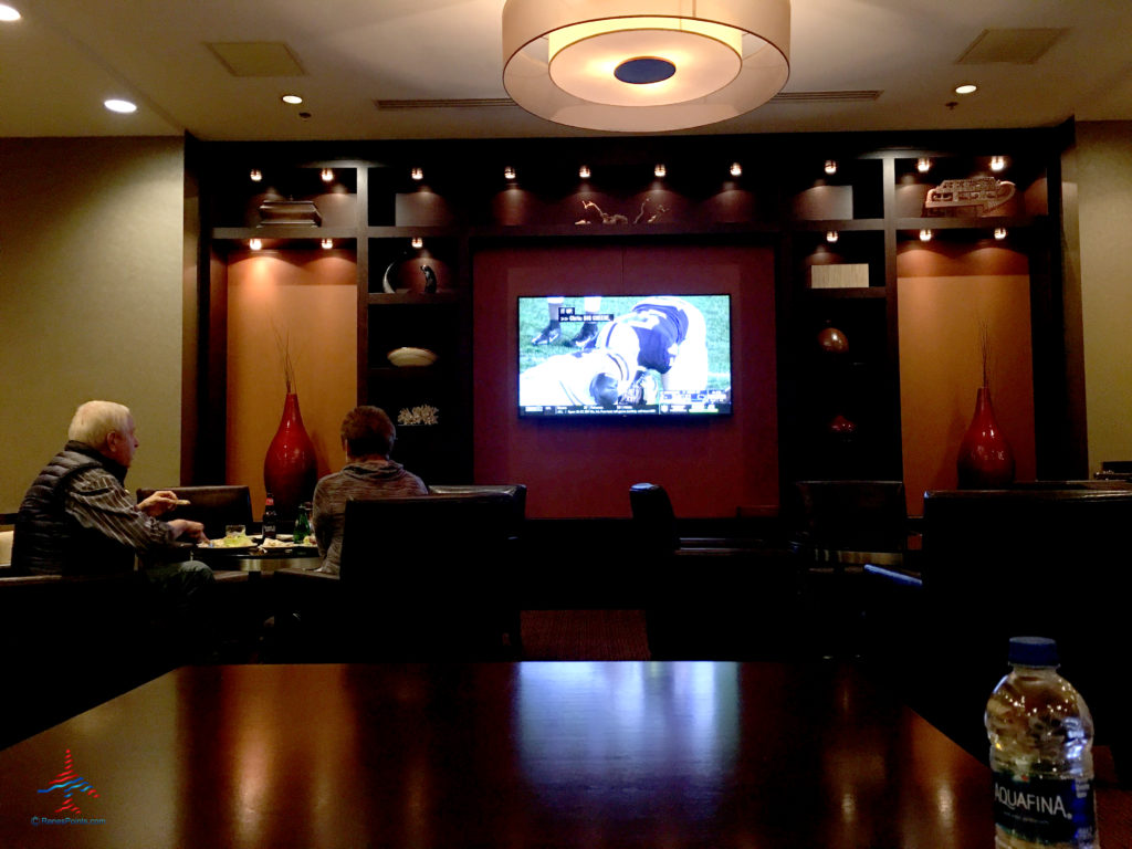 Guests enjoy a televised football game displayed inside the Regency Club lounge at the Hyatt Regency O'Hare Chicago airport hotel in Rosemont, Illinois.