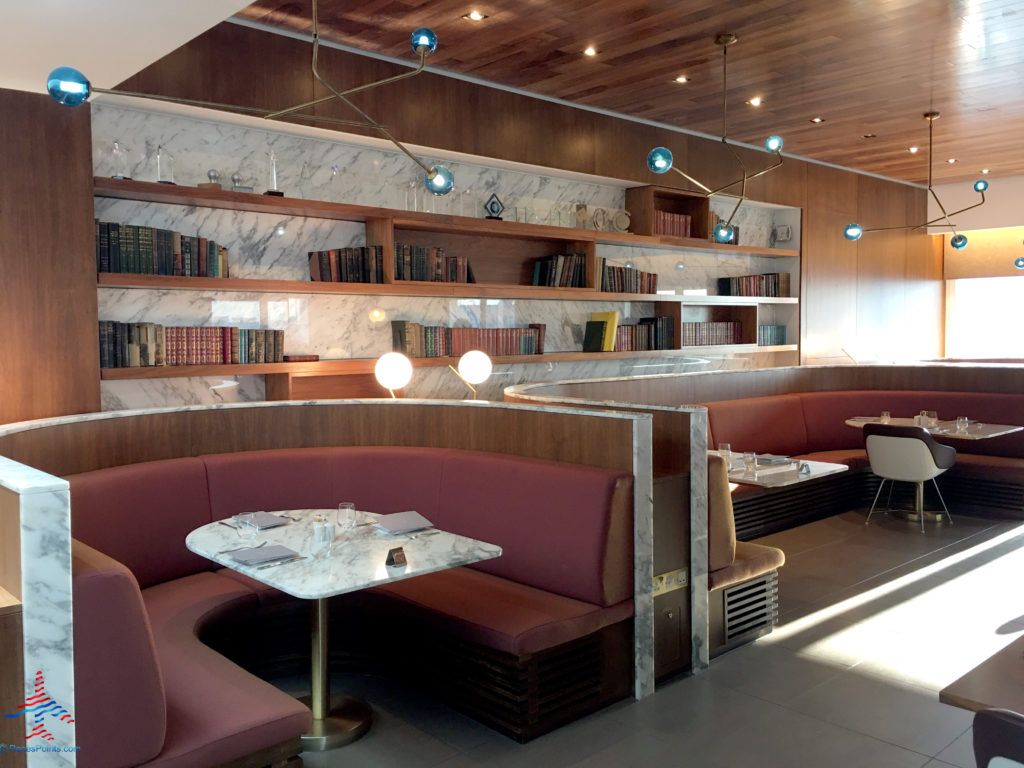 Booth seating is seen inside the Virgin Atlantic Clubhouse airport lounge at London Heathrow Airport (LHR).