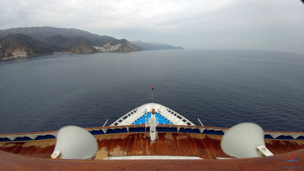 a ship's deck with satellite dishes on the front