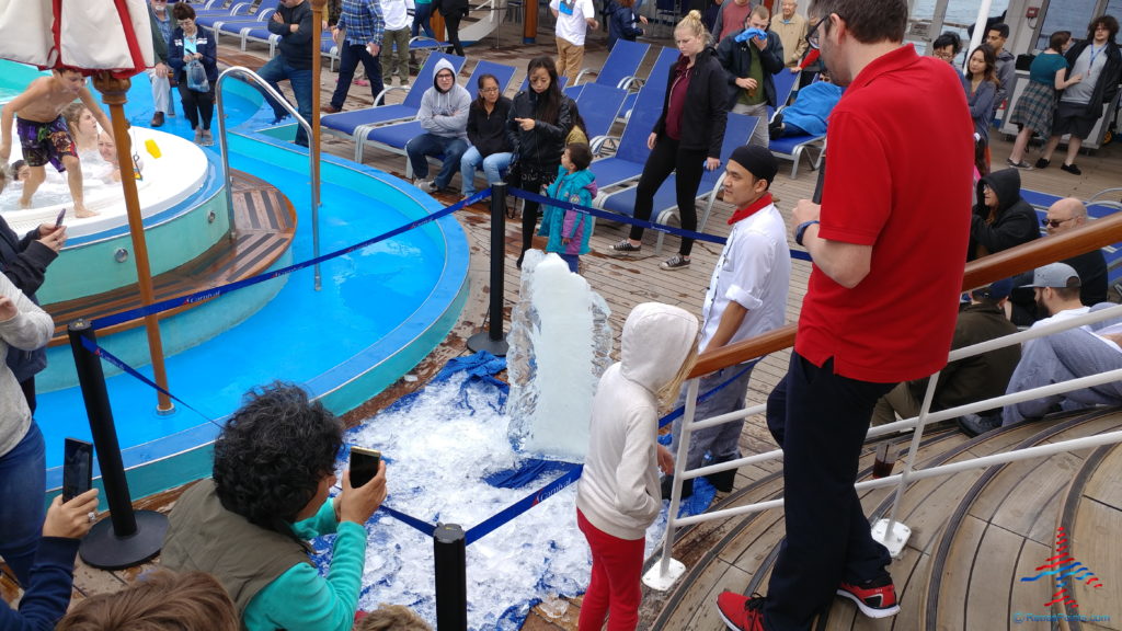 a group of people around a pool