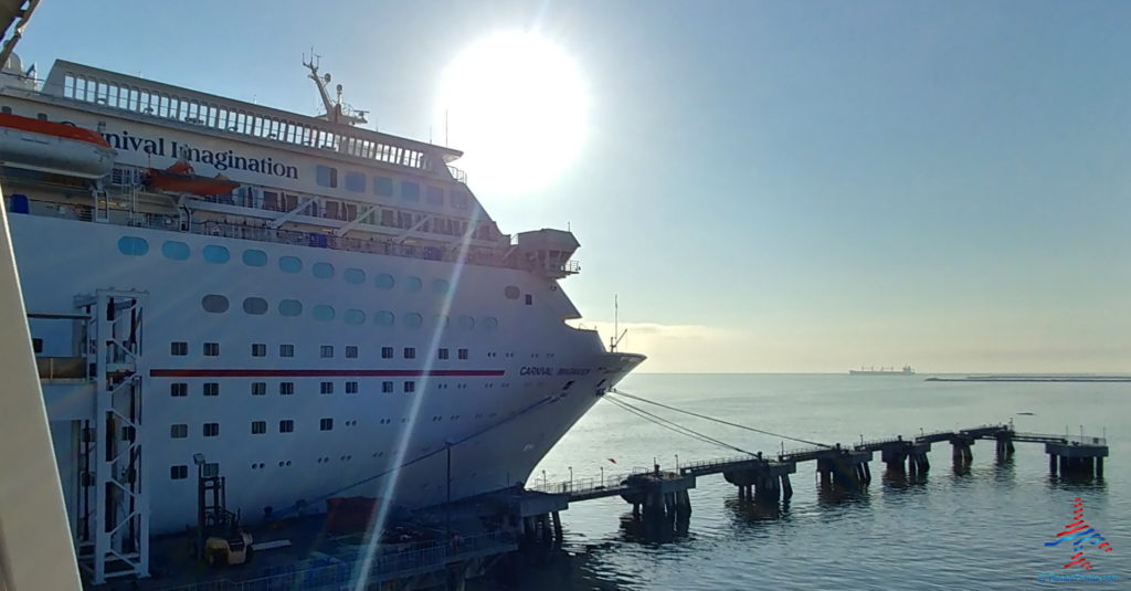 a cruise ship docked at a dock