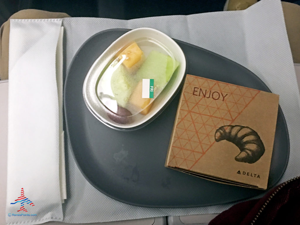 Melons and an egg and Swiss cheese croissant -- part of Delta's Main Cabin international experience -- is seen on a Boeing 767-300ER from Salt Lake City to Paris Charles de Gaulle.