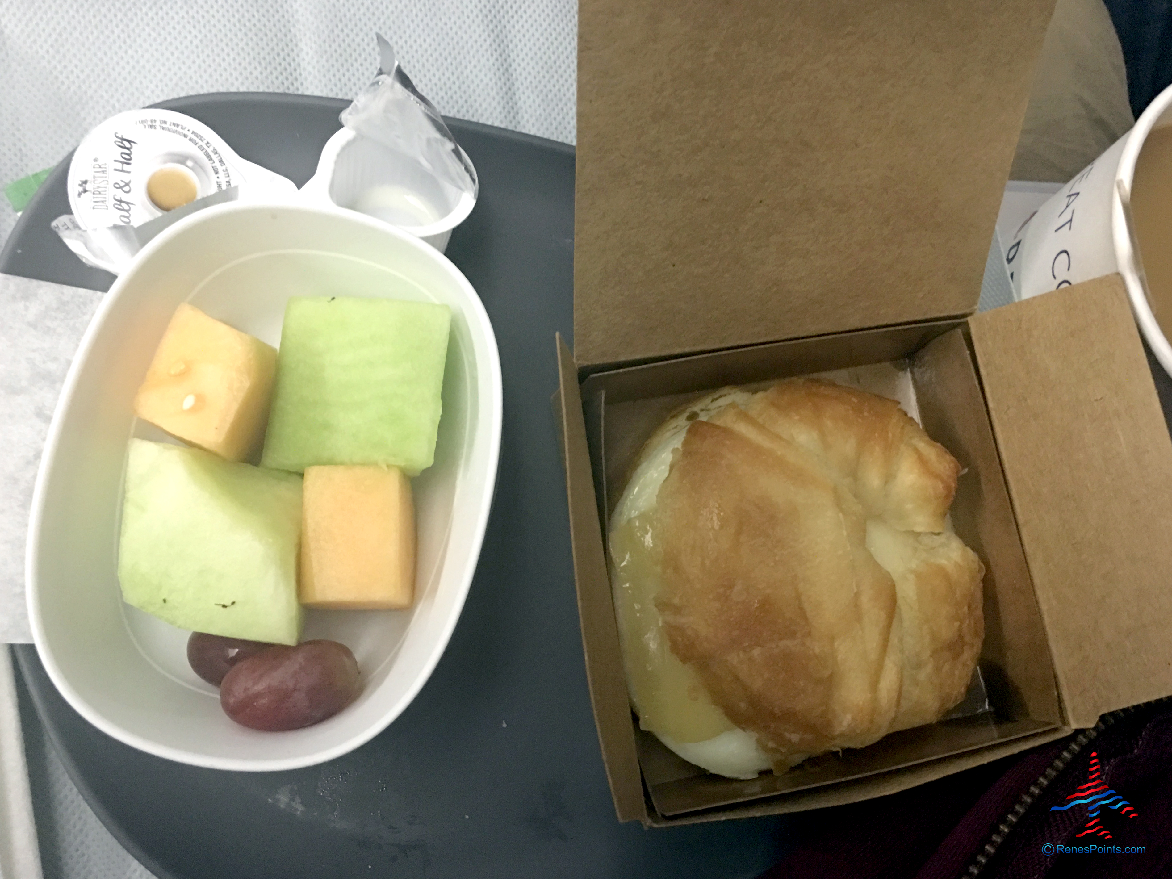 Melons and an egg and Swiss cheese croissant -- part of Delta's Main Cabin international experience -- is seen on a Boeing 767-300ER from Salt Lake City to Paris Charles de Gaulle.