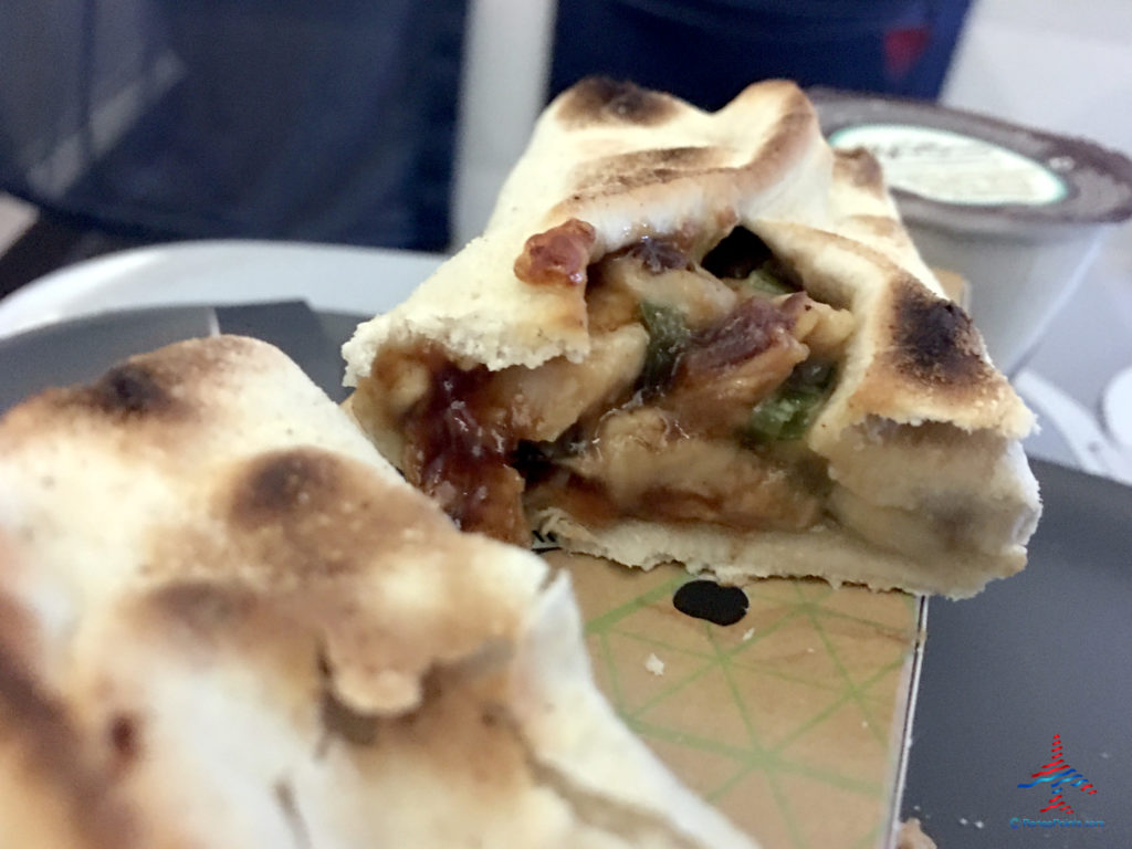 A barbecue chicken wrap is featured as part of Delta's Main Cabin international experience as seen on a Delta Air Lines Airbus A330-300 flight from London Heathrow to Atlanta Hartsfield Airport.