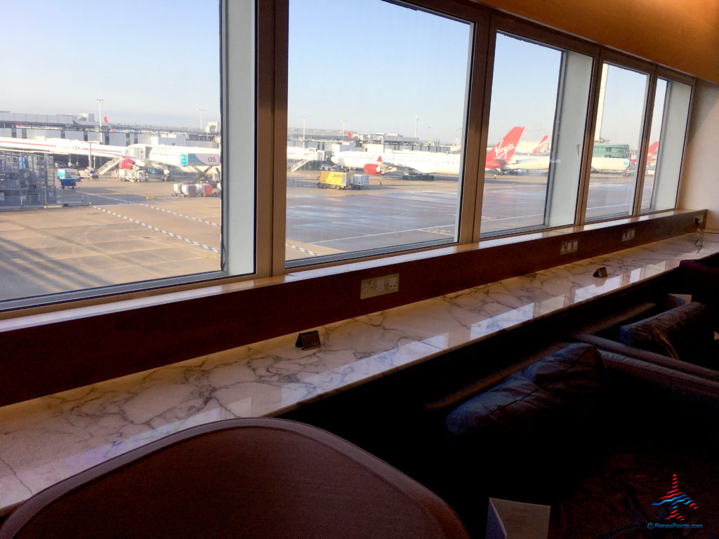 Virgin Atlantic aircraft are seen from inside the Virgin Atlantic Clubhouse airport lounge at London Heathrow Airport (LHR).