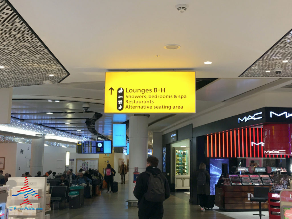 Signage in Terminal 3 directs guests to the Virgin Atlantic Clubhouse airport lounge at London Heathrow Airport (LHR).