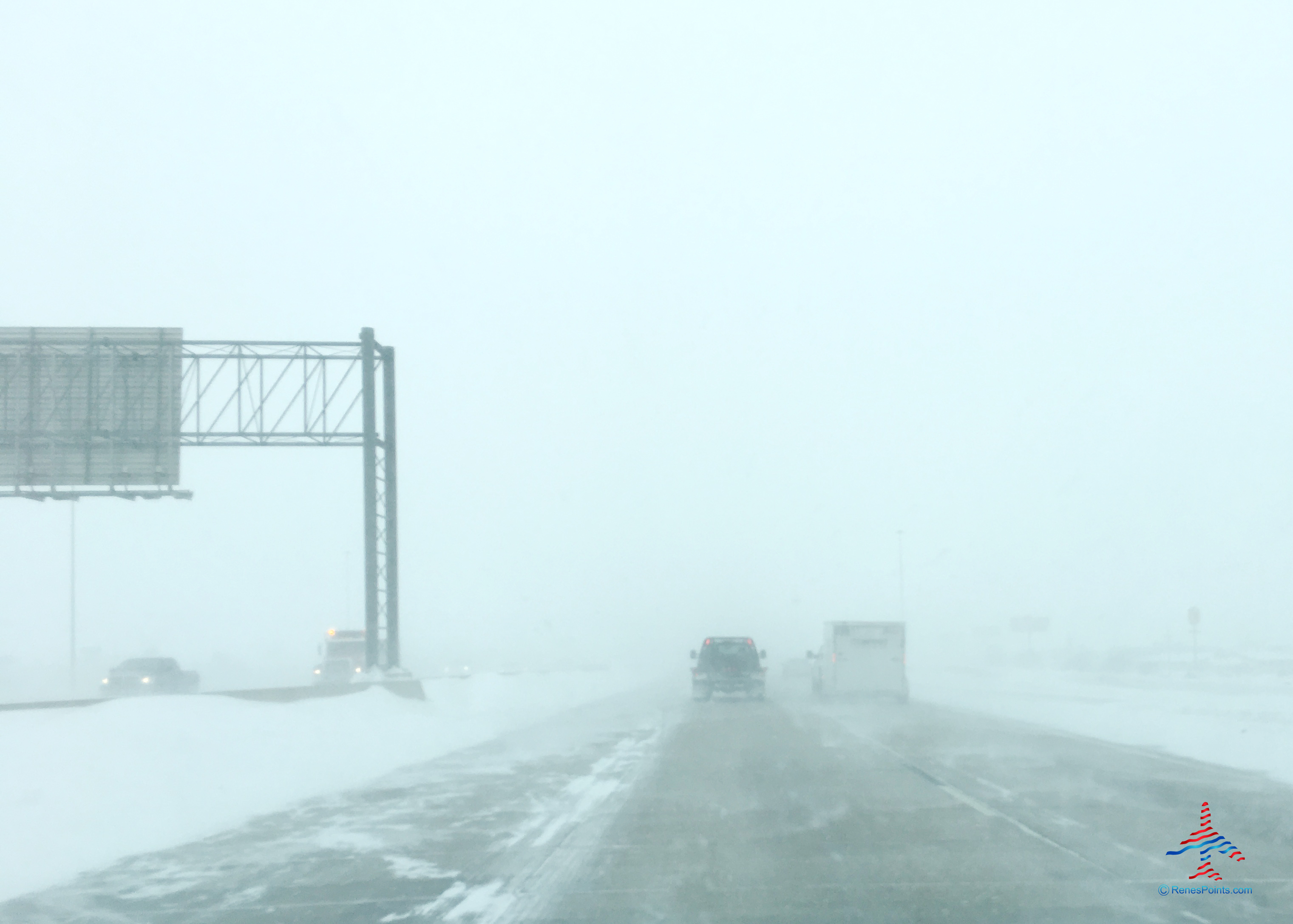 Blizzard conditions appear during a winter storm in Fargo, North Dakota, as seen from a car driving north on Interstate 29 near 13th Avenue South.