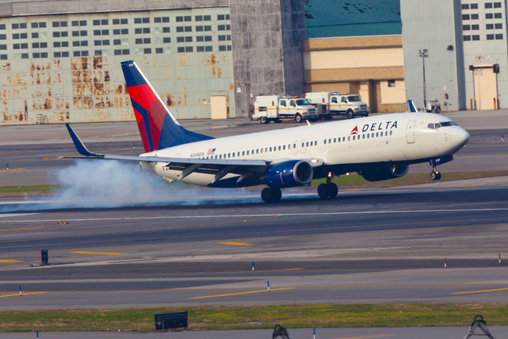 "New York USA - October 26, 2011: Boeing 737NG Delta Air Lines lands on at the John F Kennedy International Airport located in New York which is one of the most busy airports in the world"