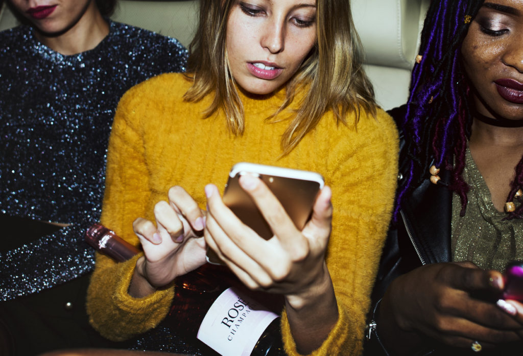 a woman looking at a phone