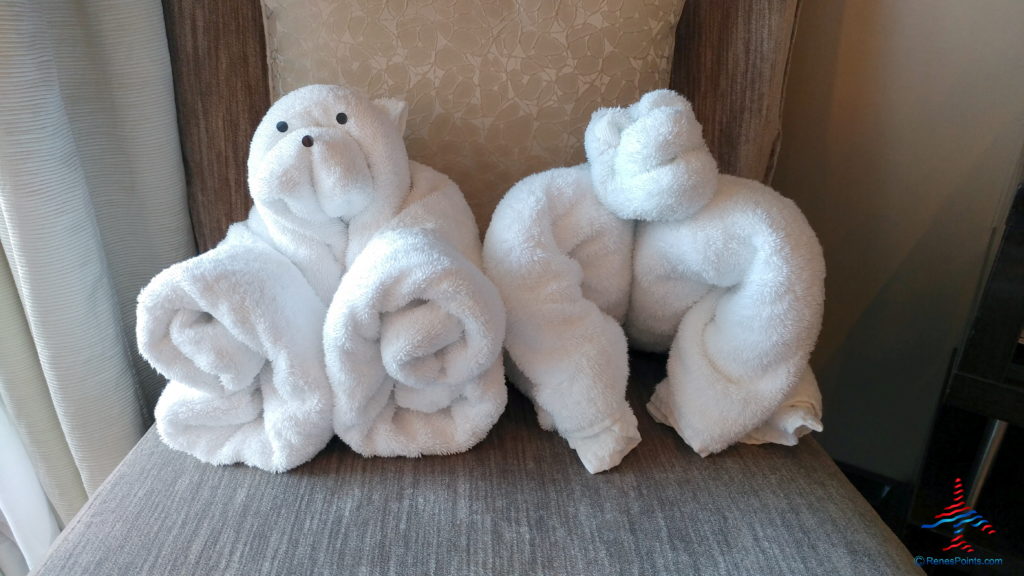 a couple of white towels folded into animals