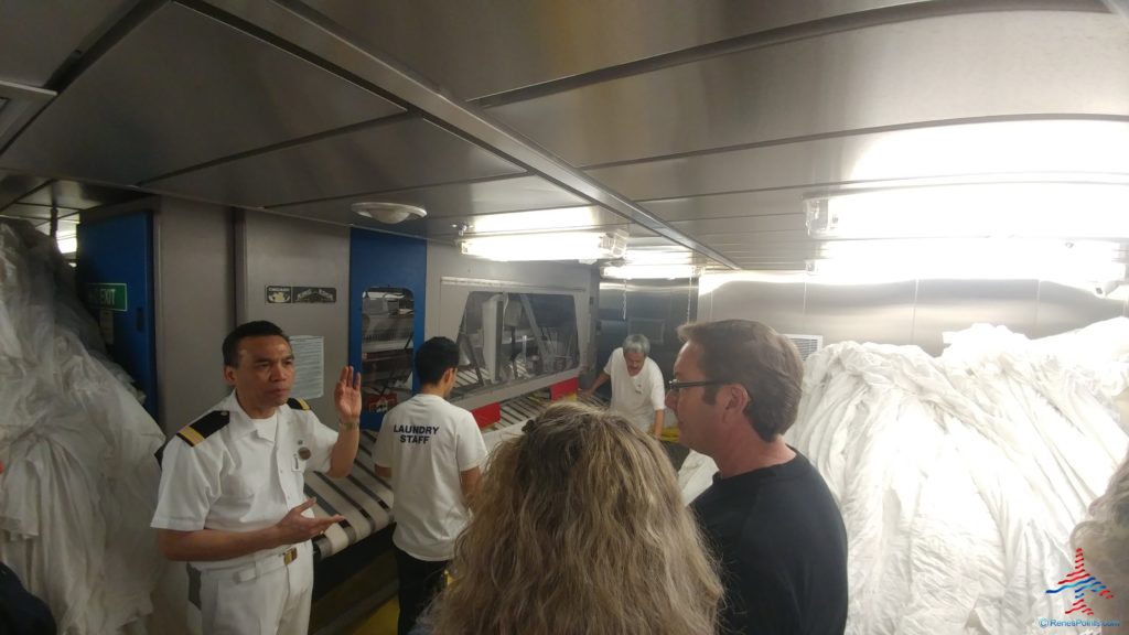 a group of people in a laundry room