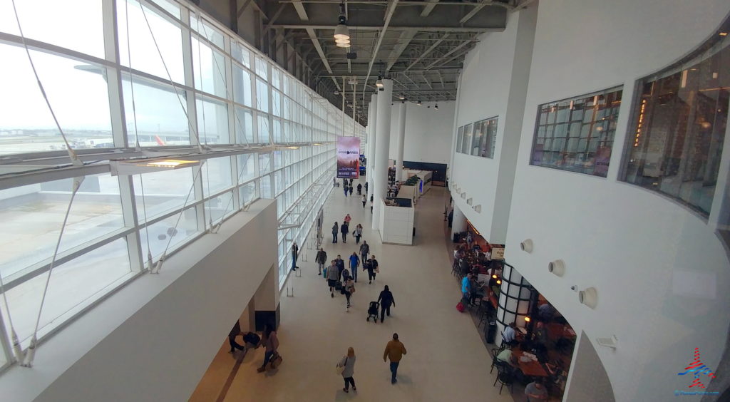 a group of people walking in a large building