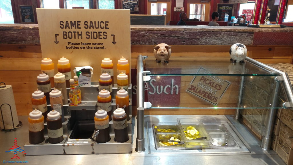 a counter with a sign and a pig figure on top